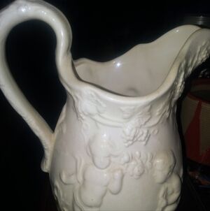 White Ceramic Cherub Decorative Pitcher - Classic Relief Design